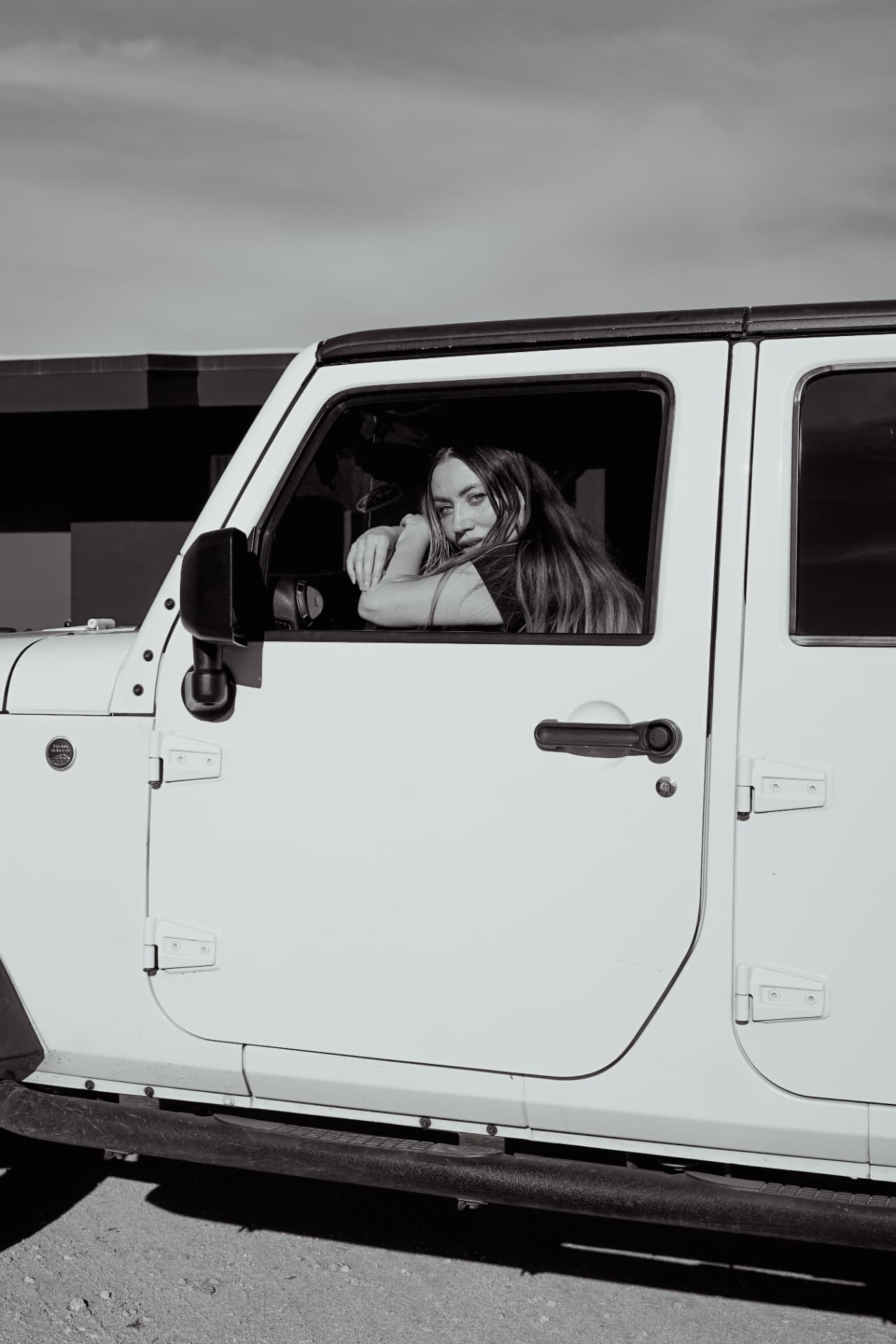 Caley Dimmock in a white Jeep